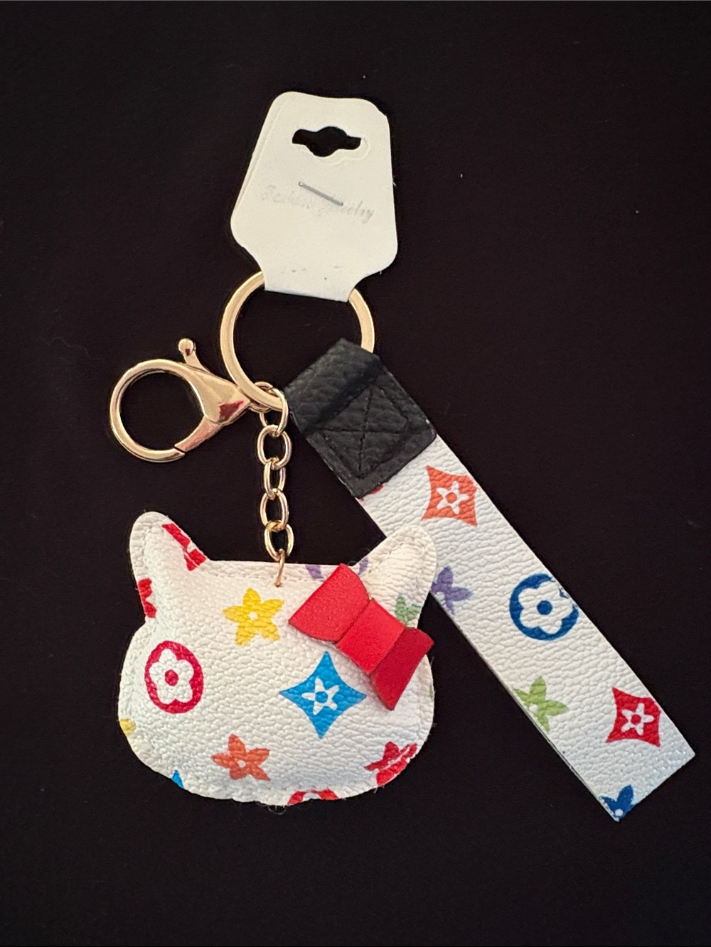 White Multicolor Fashion Monogram Hello Kitty Keychain Bag Charm with Red Bow